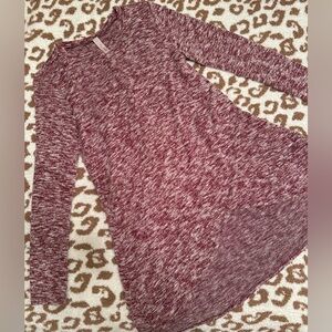 Tunic sweater with front crisscross hem. Size small.